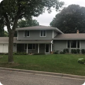 Before and after images of a residential roof replacement project by Sunrise Remodelers