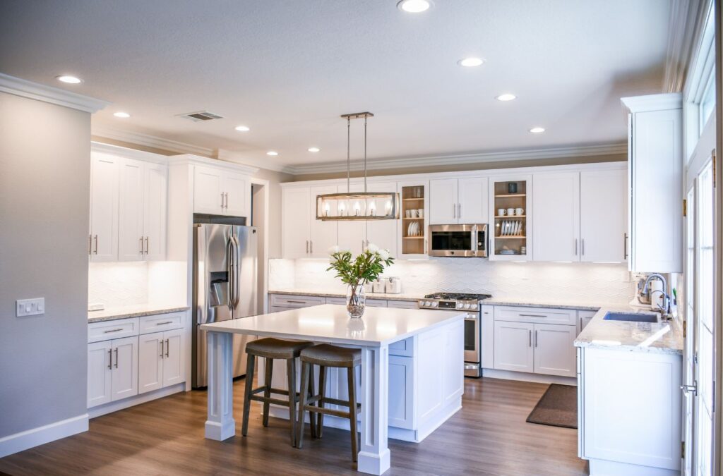 A skilled remodeler from Sunrise Remodelers discussing renovation plans with a client in Andover, MN, to ensure personalized service.