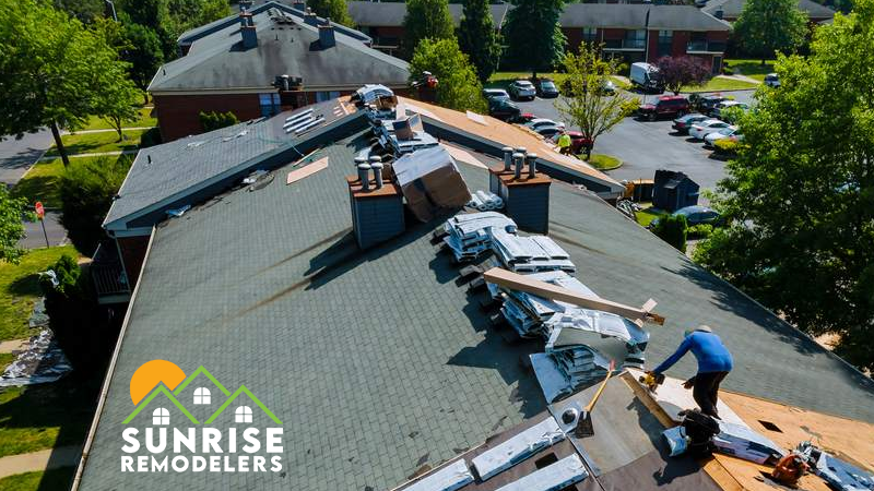 A professional roofing crew installing a new asphalt shingle roof on a home in Twin Cities, MN, ensuring durability and weather protection.